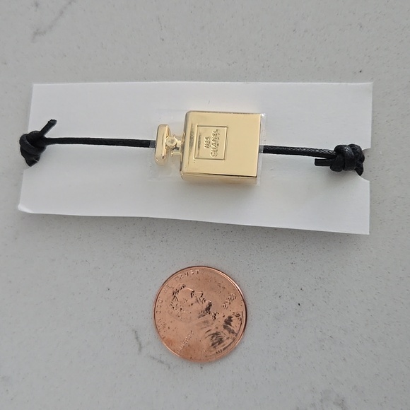 Brand new never used CHANEL bracelet gold bottle charm N°5 adjustable black cord - Picture 5 of 6
